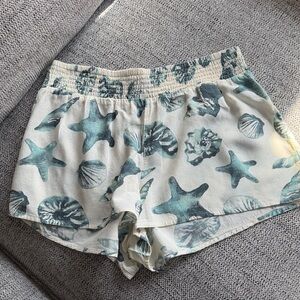 O'Neill Brand New Cream Shorts with Teal Sea Shell Print
